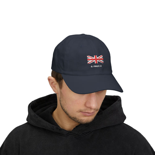 English Man wearing Blue Cap which has the British Flag on the front center  and says '& Proud'